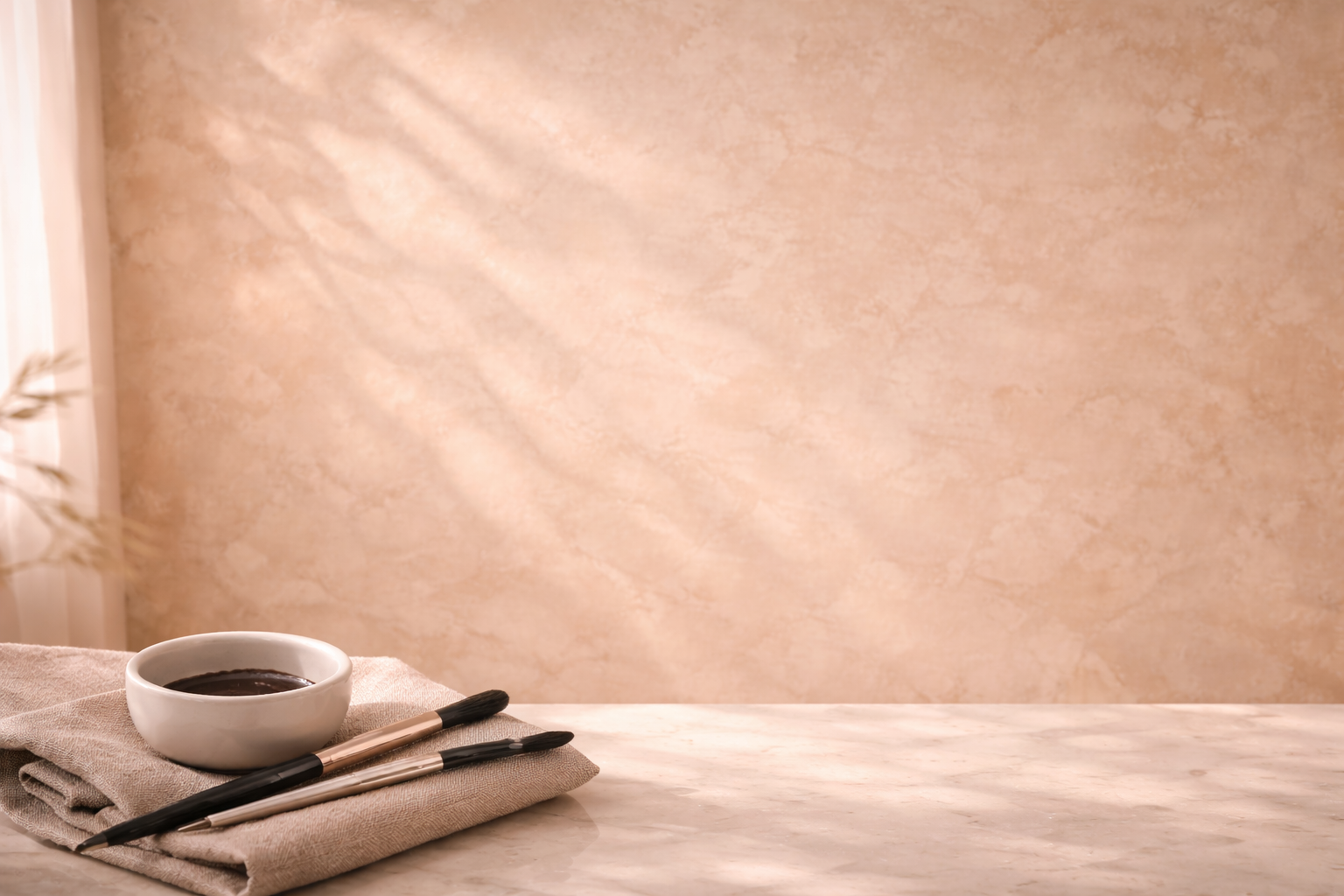 Warm glowing architectural plaster background with subtle spa elements